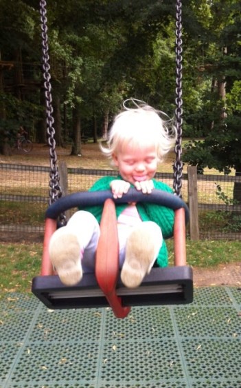 Grace loves the swings!